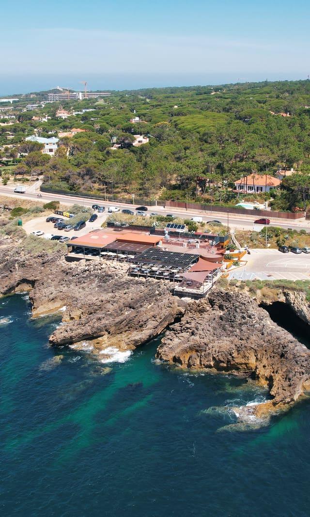 Aerial view of the coast with the restaurant above the rocks