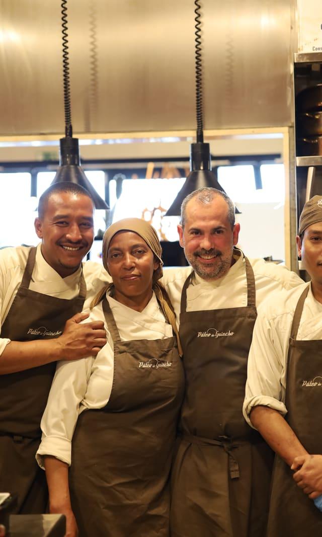 Páteo kitchen team smiling in their aprons