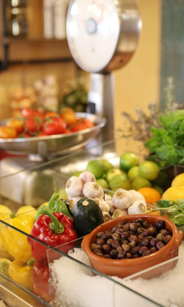 Display of fresh fruit and vegetables at a grocer's